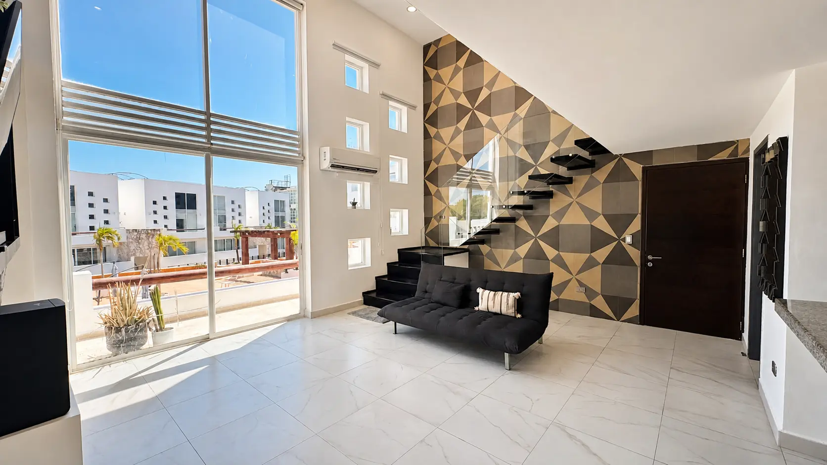 Estancia de doble altura del loft en venta en Playa del Carmen